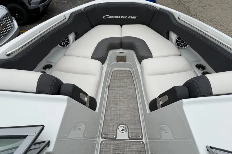 Slide: The Image of 2022 Crownline 255 SS boat interior with plush seating and modern design. - 2