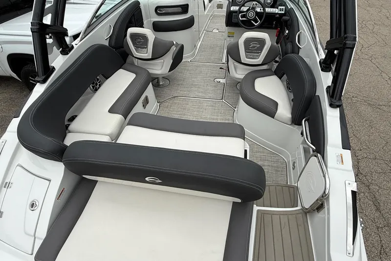 Slide: The Image of 2022 Crownline 255 SS boat interior with sleek seating and modern dashboard design. - 4