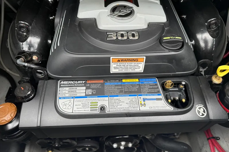 Slide: The Image of 2022 Crownline 255 SS engine, Mercury 300, maintenance schedule visible. - 8