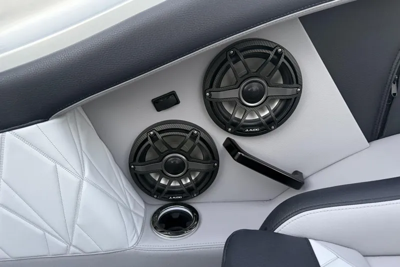 Slide: The Image of 2025 Nor-Tech 4000 Roadster interior with sleek black and white seats, green accents. - 14