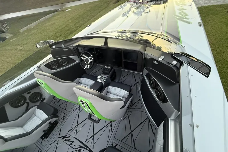 Slide: The Image of 2025 Nor-Tech 4000 Roadster with triple outboard engines on a trailer. - 8