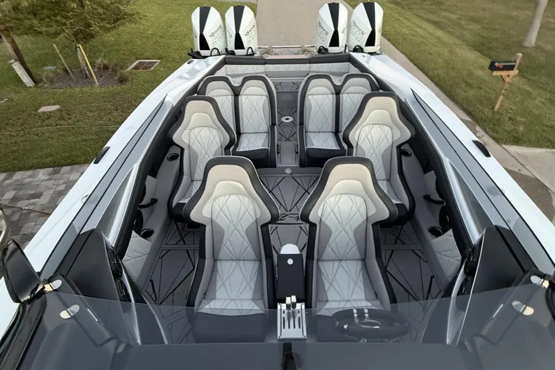 Slide: The Image of Nor-Tech 4000 Roadster 2025 boat hull, sleek design under a cloudy sky. - 9