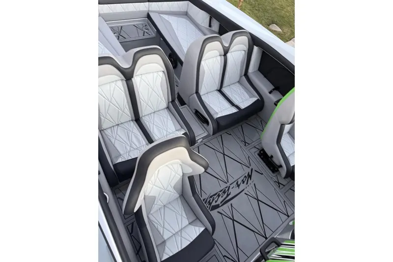 Slide: The Image of Luxurious interior of 2026 Nor-Tech 4000 Roadster with stylish white and gray seating. - 10