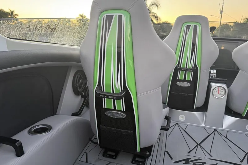 Slide: The Image of 2026 Nor-Tech 4000 Roadster interior with green-accented seats and modern design elements. - 11