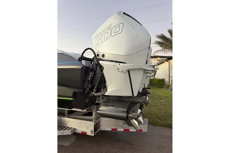 Slide: The Image of 2026 Nor-Tech 4000 Roadster with powerful outboard engine, parked on a trailer. - 19