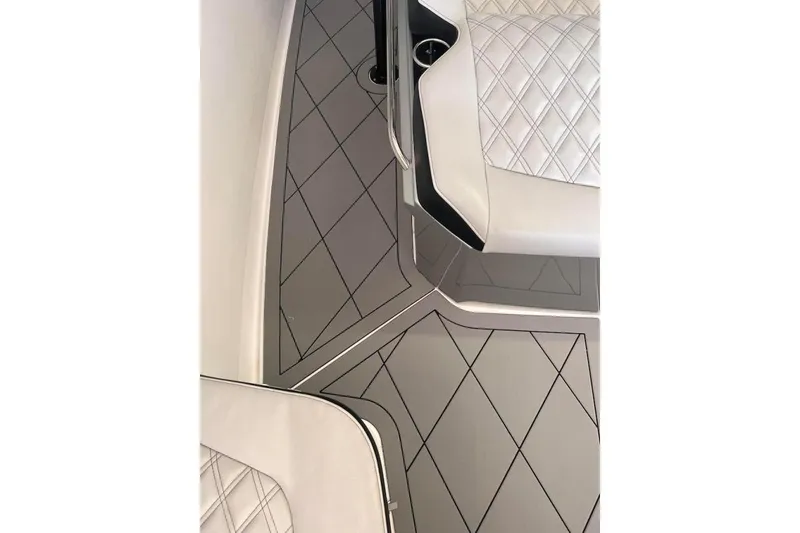 Slide: The Image of 2017 Nor-Tech 340 Sport Center Console interior with diamond-stitched seating and sleek flooring design. - 10