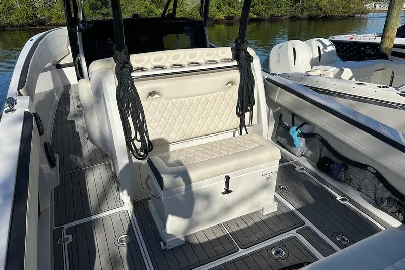Slide: The Image of 2017 Nor-Tech 340 Sport Center Console boat interior with seating and storage. - 11