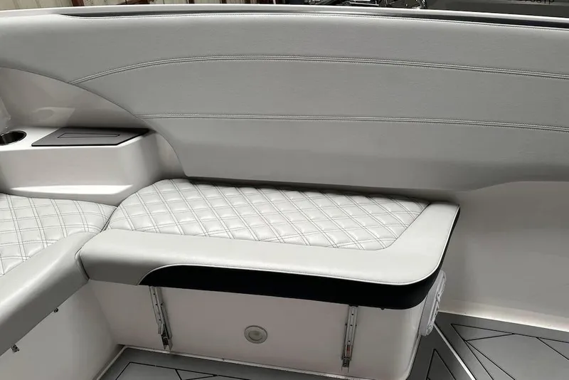 Slide: The Image of 2017 Nor-Tech 340 Sport Center Console interior with quilted seating and storage. - 12
