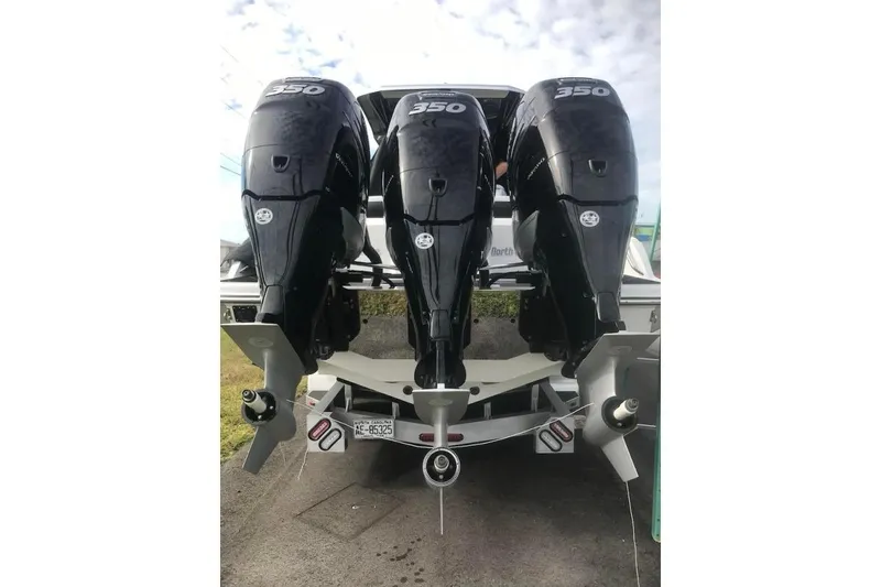 Slide: The Image of 2017 Nor-Tech 340 Sport Center Console with triple 350 horsepower engines. - 19
