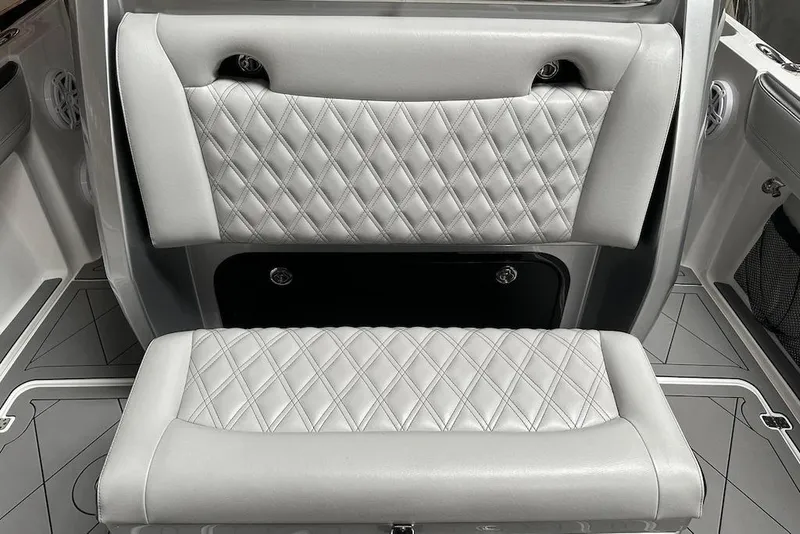 Slide: The Image of 2017 Nor-Tech 340 Sport Center Console interior with diamond-stitched seating. - 7