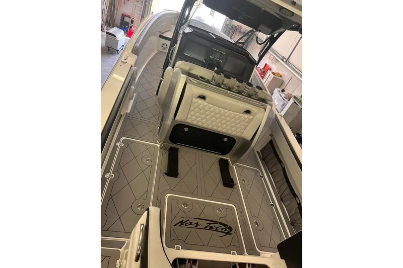 Slide: The Image of 2017 Nor-Tech 340 Sport Center Console boat interior with sleek design and modern features. - 8