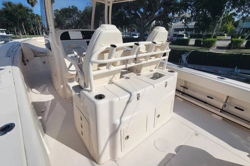 Slide: The Image of 2019 Grady-White Canyon 306 boat interior with helm and seating area. - 10