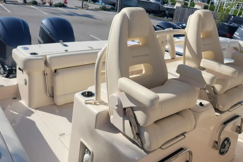 Slide: The Image of 2019 Grady-White Canyon 306 boat with luxurious seating and dual outboard engines. - 11