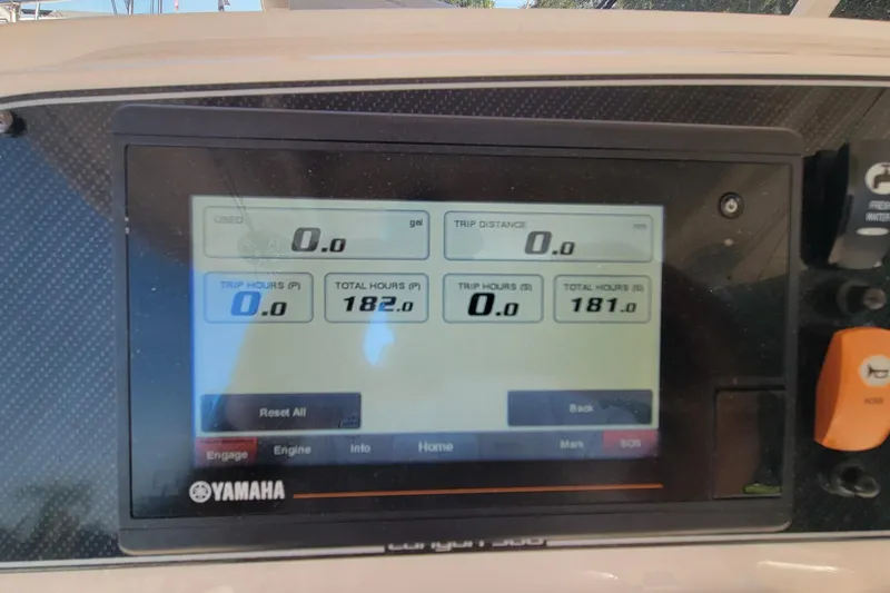 Slide: The Image of Yamaha display on 2019 Grady-White Canyon 306 showing trip and engine hours. - 13