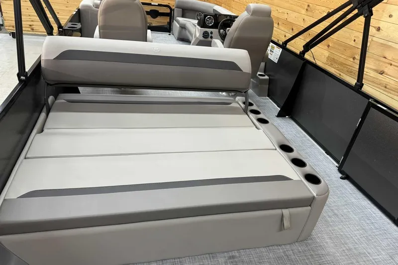 Slide: The Image of 2025 Premier Sunscape 220 RL boat interior with gray seating and cup holders. - 10