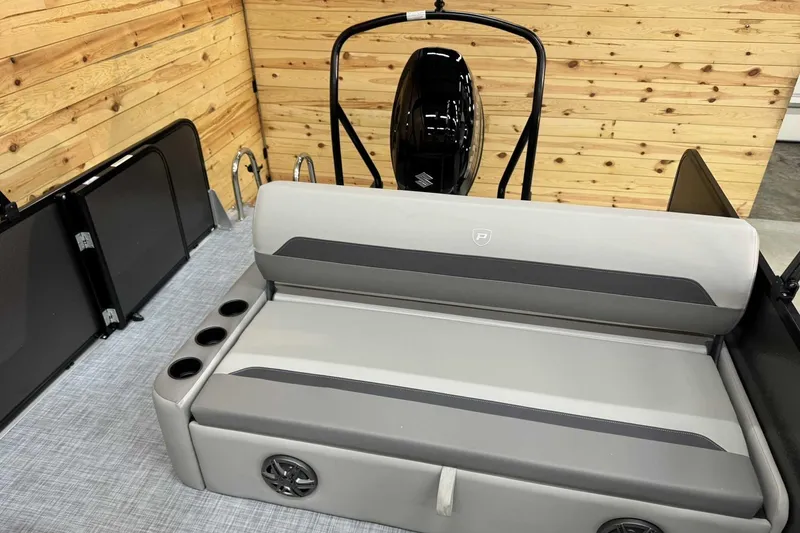 Slide: The Image of 2025 Premier Sunscape 220 RL boat interior with gray seating and cup holders. - 9