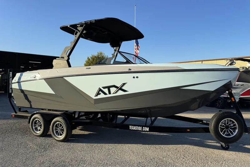 The Image of 2026 ATX Surf Boats 22 Type-S on trailer, sleek design, outdoor display. - 1
