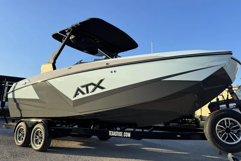 Slide: The Image of 2026 ATX Surf Boats 22 Type-S on trailer, sleek design under clear blue sky. - 11