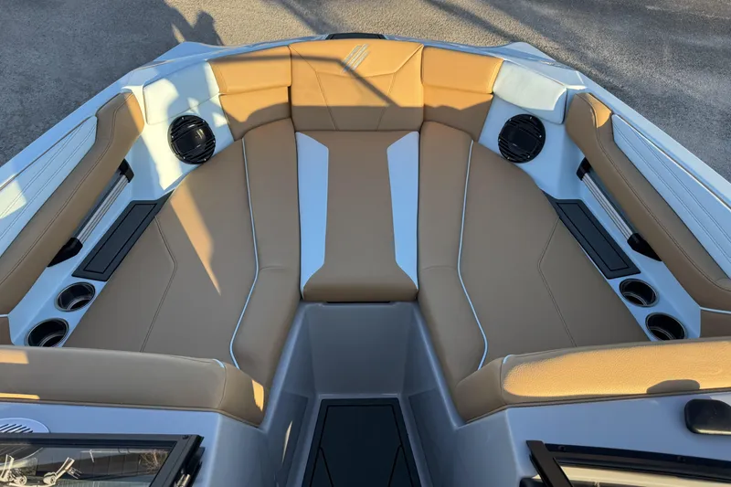 Slide: The Image of 2026 ATX Surf Boats 22 Type-S interior with tan seating and cup holders. - 12