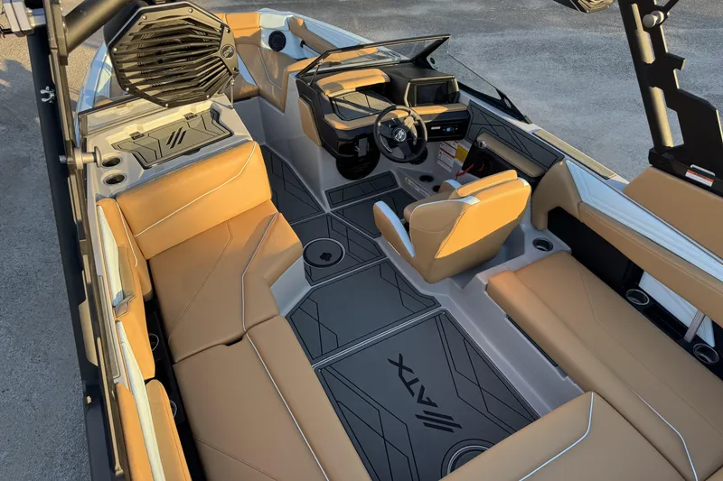 Slide: The Image of 2026 ATX Surf Boats 22 Type-S interior with tan seating and modern dashboard design. - 13