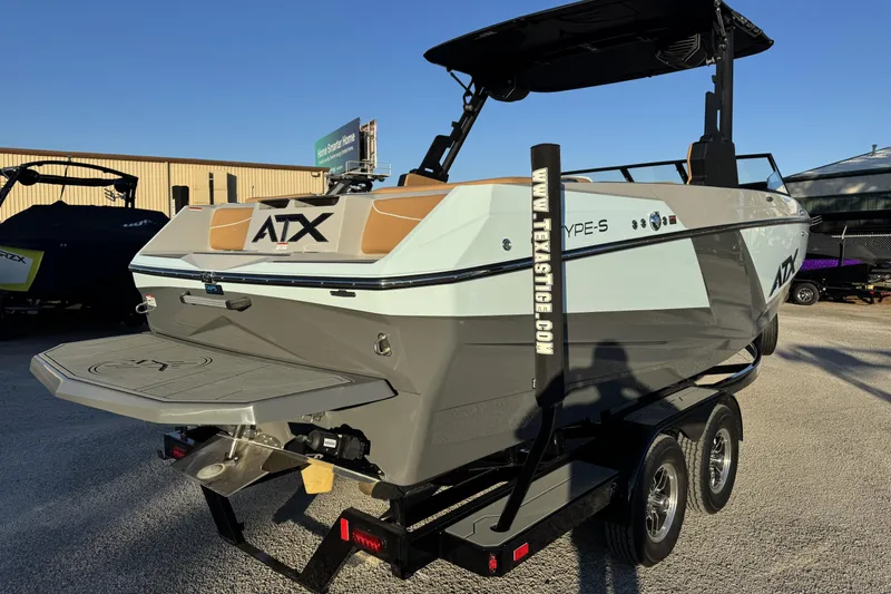 Slide: The Image of 2026 ATX Surf Boats 22 Type-S on trailer, sleek design, outdoor display. - 3