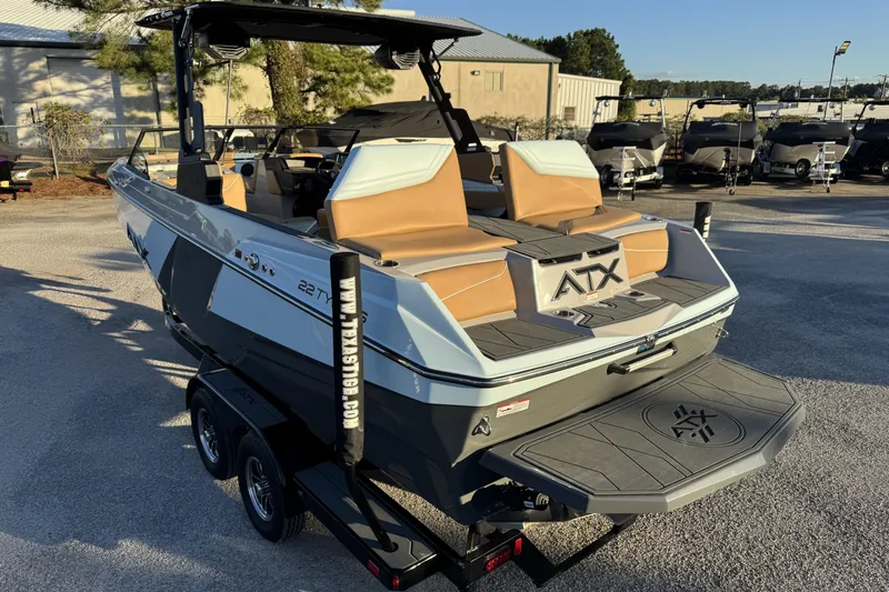 Slide: The Image of 2026 ATX Surf Boats 22 Type-S on trailer, showcasing sleek design and spacious seating. - 5