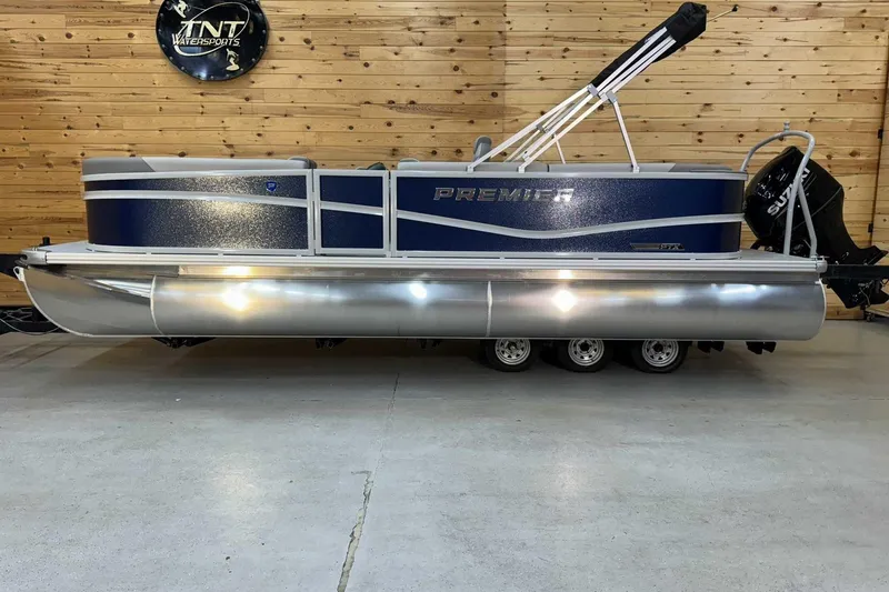 The Image of 2025 Premier Sunscape 220 RF XLC pontoon boat in showroom, wooden wall background. - 1