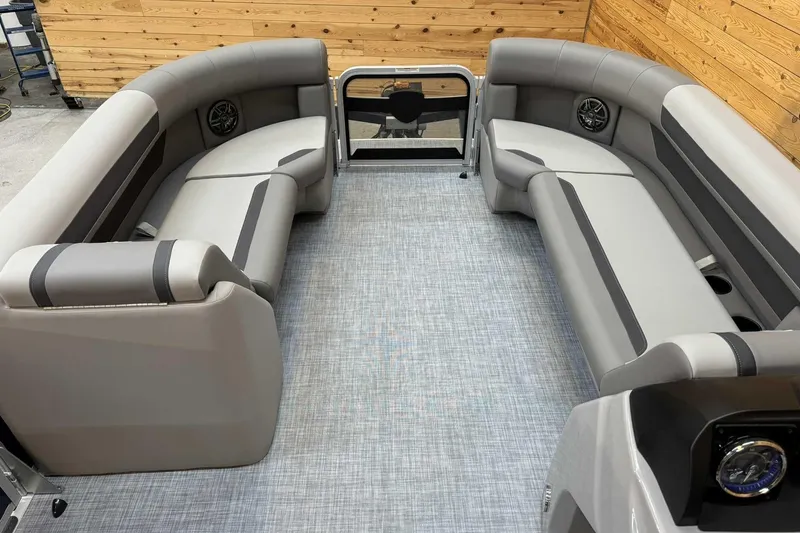Slide: The Image of 2025 Premier Sunscape 220 RF XLC pontoon boat interior with gray seating and modern design. - 10