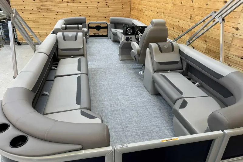 Slide: The Image of 2025 Premier Sunscape 220 RF XLC pontoon boat interior with luxurious seating and modern design. - 12
