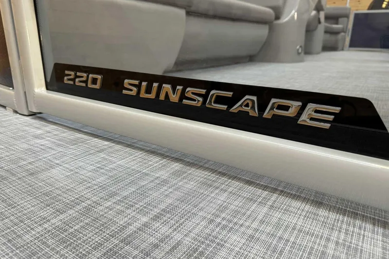 Slide: The Image of 2025 Premier Sunscape 220 RF XLC boat interior with sleek design and branding. - 6