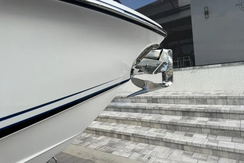 Slide: The Image of 2025 Nor-Tech 390 Sport Center Console boat with sleek design and modern anchor. - 2