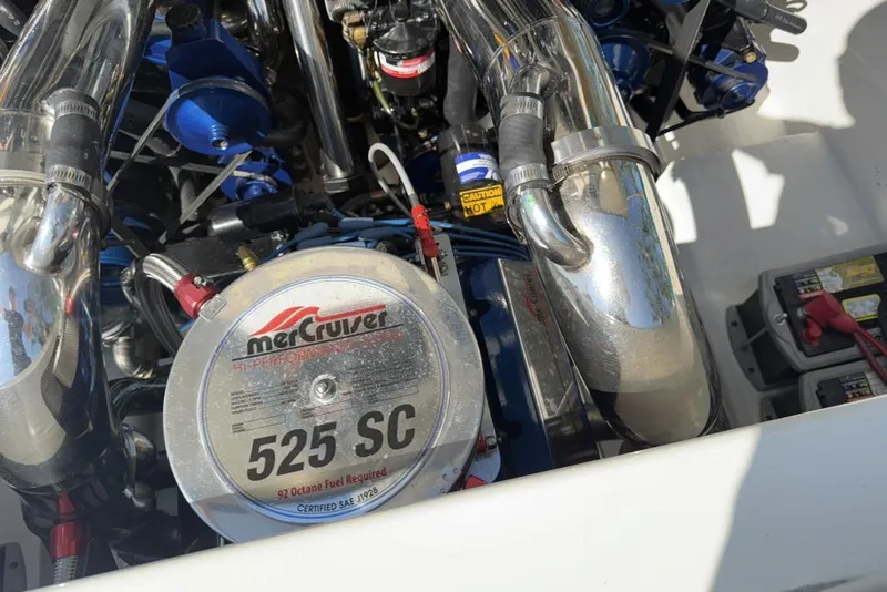 Slide: The Image of Engine of 1999 Hustler 388 SLINGSHOT with MerCruiser 525 SC visible. - 2