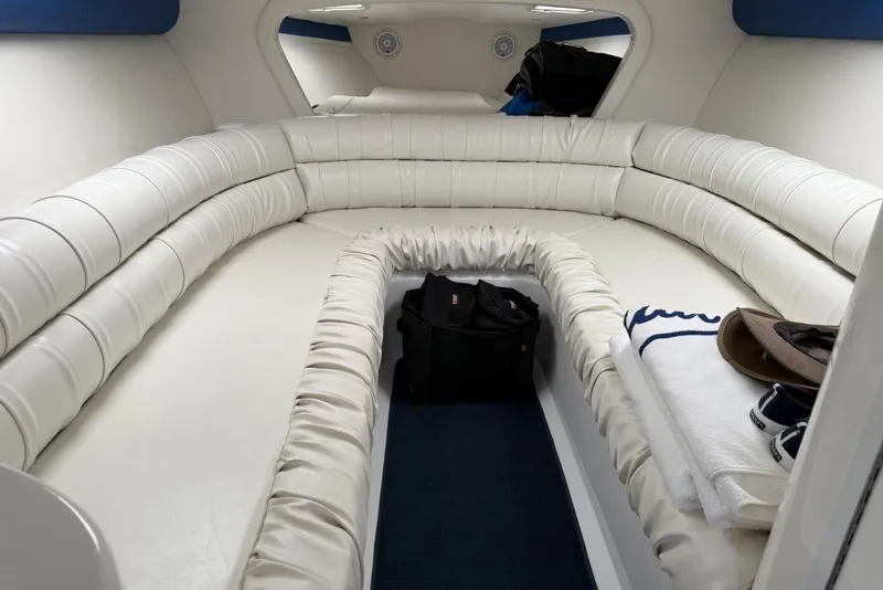 Slide: The Image of Luxurious interior of 1999 Hustler 388 SLINGSHOT boat with white seating and accessories. - 3
