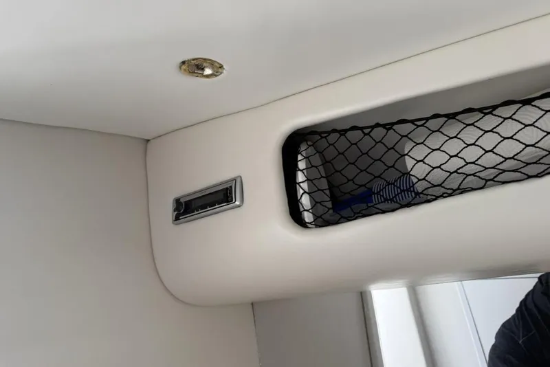 Slide: The Image of Interior of 1999 Hustler 388 SLINGSHOT with storage net and light fixture. - 4