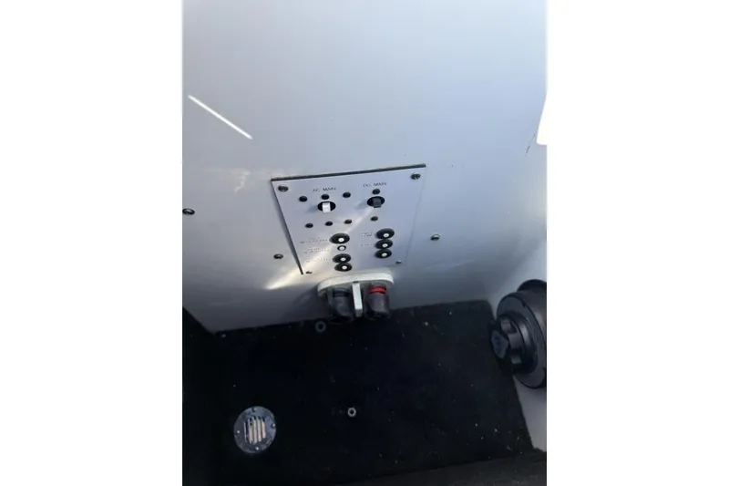 Slide: The Image of Control panel of a 1999 Hustler 388 SLINGSHOT boat interior. - 5