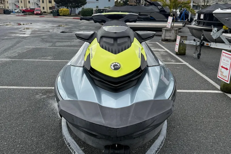 Slide: The Image of 2021 Sea-Doo GTI SE 130 jet ski parked in a lot, front view. - 15