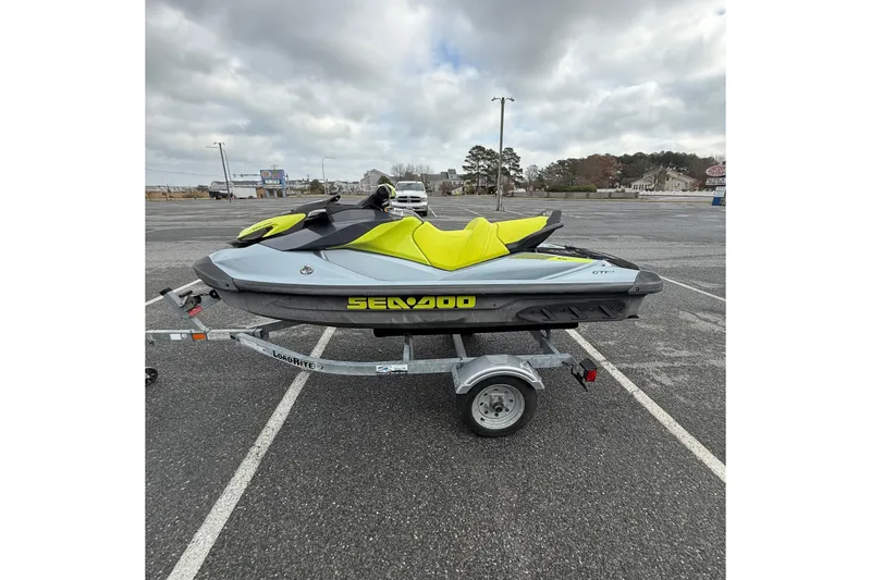 Slide: The Image of 2021 Sea-Doo GTI SE 130 jet ski on trailer in parking lot. - 17
