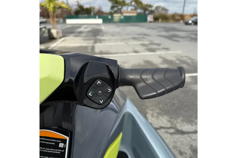 Slide: The Image of Handlebar controls of 2021 Sea-Doo GTI SE 130 in a parking lot. - 26