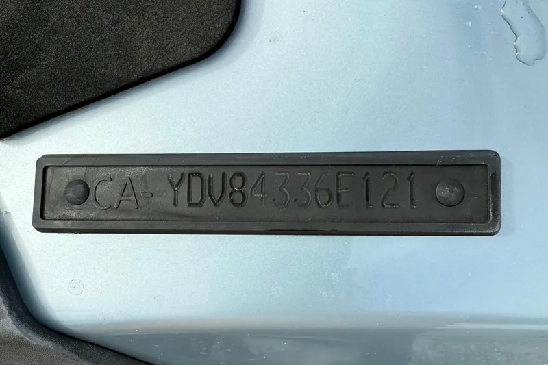 Slide: The Image of 2021 Sea-Doo GTI SE 130 hull identification number on a light blue surface. - 29