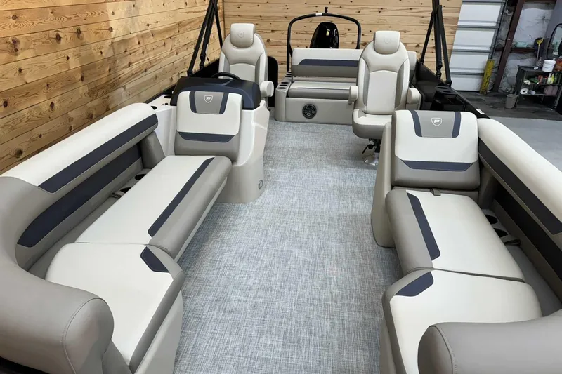 Slide: The Image of 2025 Premier Sunscape 220 RL pontoon boat interior with luxurious seating and modern design. - 6