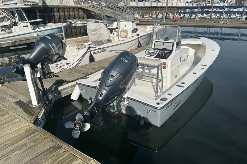 Slide: The Image of 2007 SeaCraft 20 Classic boat docked with Yamaha outboard motor. - 2