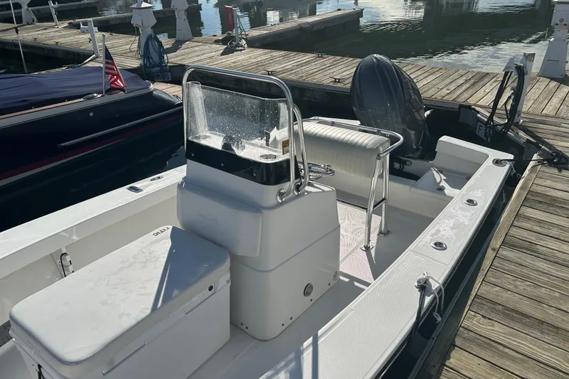 Slide: The Image of 2007 SeaCraft 20 Classic boat docked at marina, featuring center console and seating. - 4