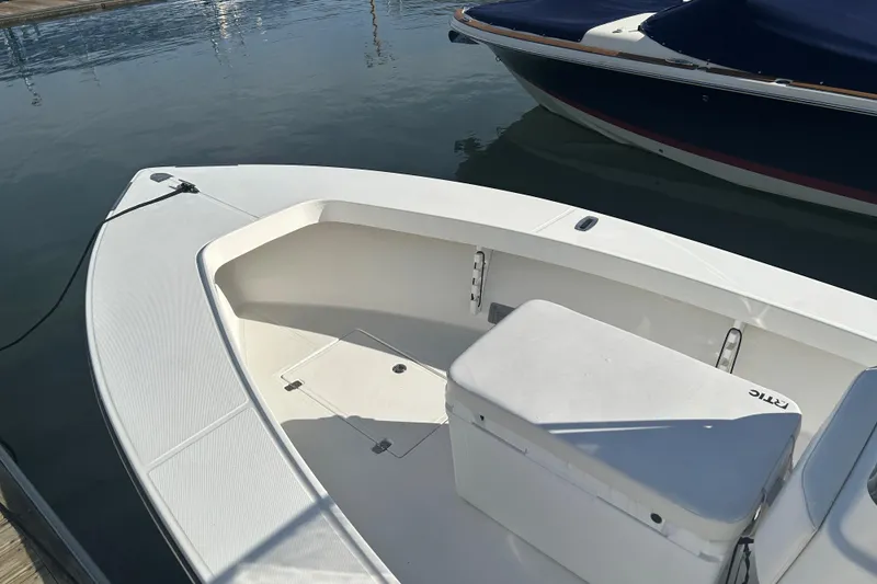 Slide: The Image of 2007 SeaCraft 20 Classic boat docked, featuring spacious seating and storage. - 5