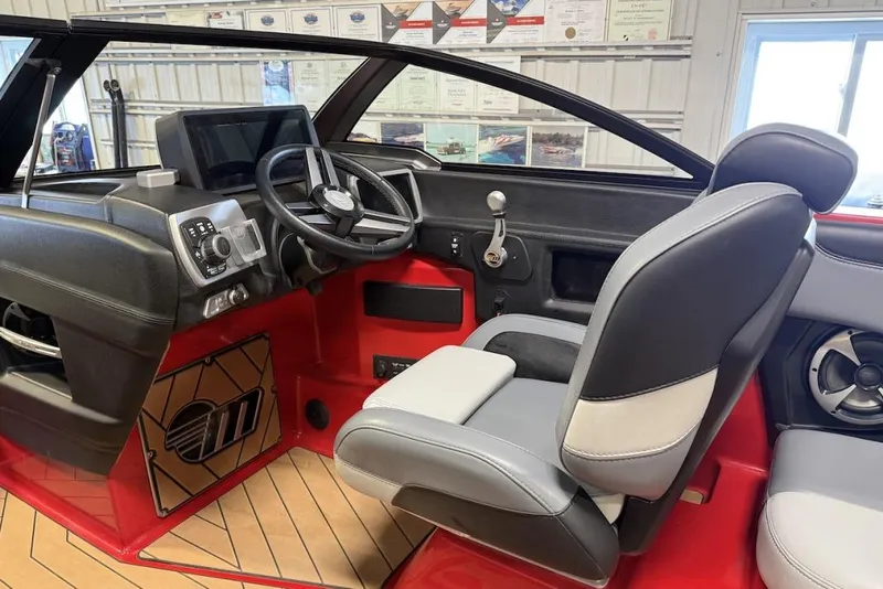 Slide: The Image of 2019 Malibu Wakesetter 23 LSV interior with modern dashboard and steering wheel. - 14