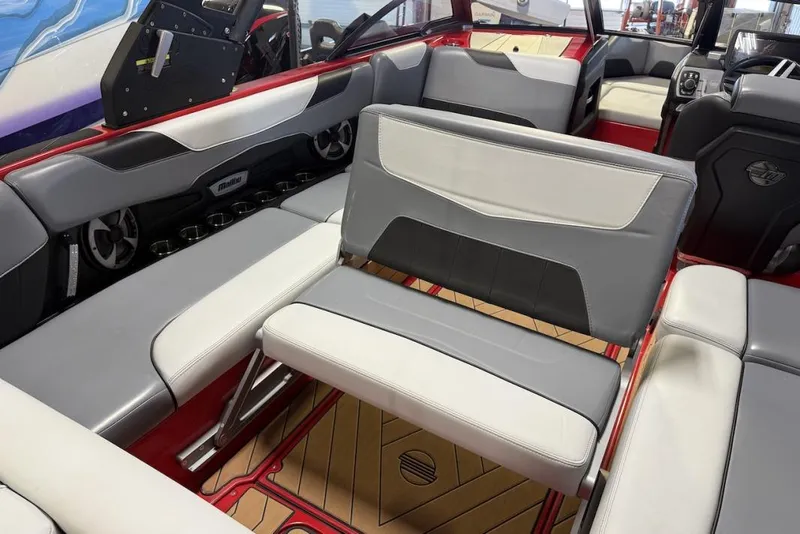 Slide: The Image of 2019 Malibu Wakesetter 23 LSV interior with gray and white seating, cup holders, and modern design. - 18