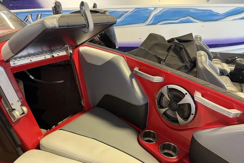 Slide: The Image of 2019 Malibu Wakesetter 23 LSV interior with red accents and speaker system. - 24
