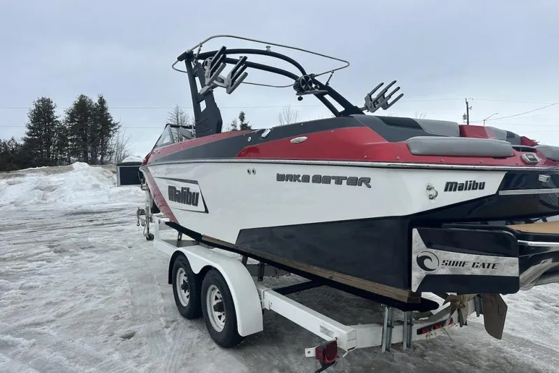 Slide: The Image of 2019 Malibu Wakesetter 23 LSV boat on trailer, parked on snowy ground. - 3