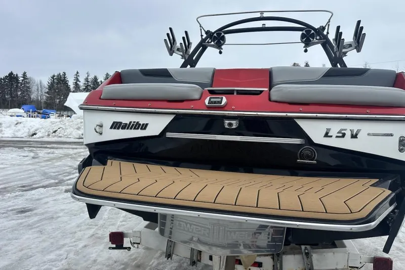 Slide: The Image of 2019 Malibu Wakesetter 23 LSV boat rear view with snow-covered background. - 7