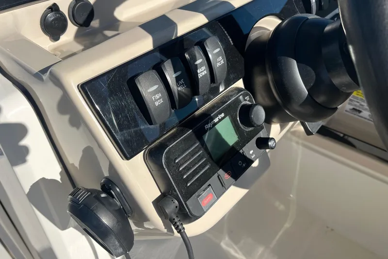Slide: The Image of Control panel of 2021 Boston Whaler 240 Vantage boat with switches and Raymarine display. - 19