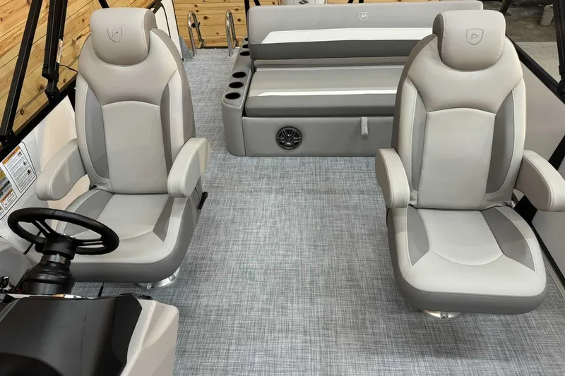 Slide: The Image of 2025 Premier Sunscape 220 RL boat interior with plush seating and modern design. - 7